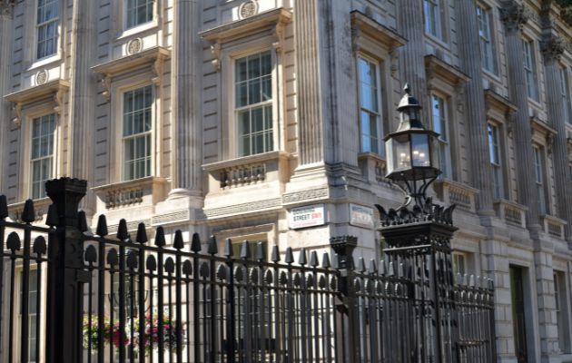 Black gated entrance to Downing Street, London